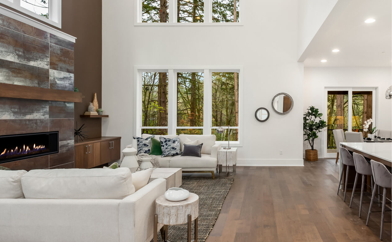 Wood look laminate floor in loft style living room with white accents. 