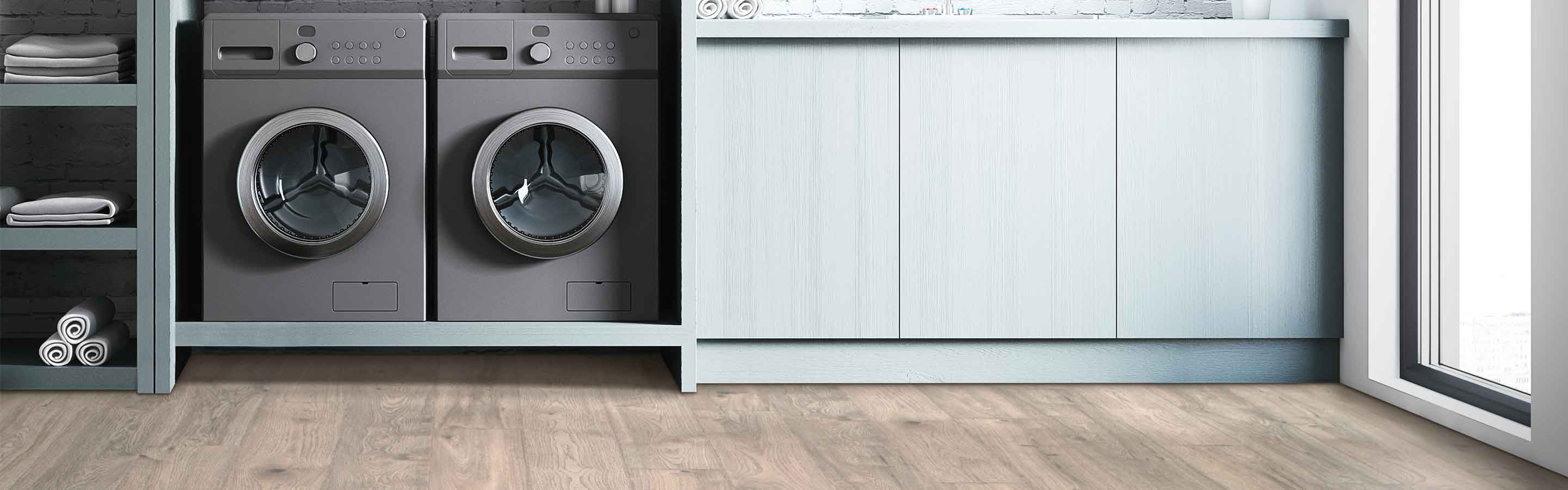 Laminate floor in the laundry room, black appliances. 